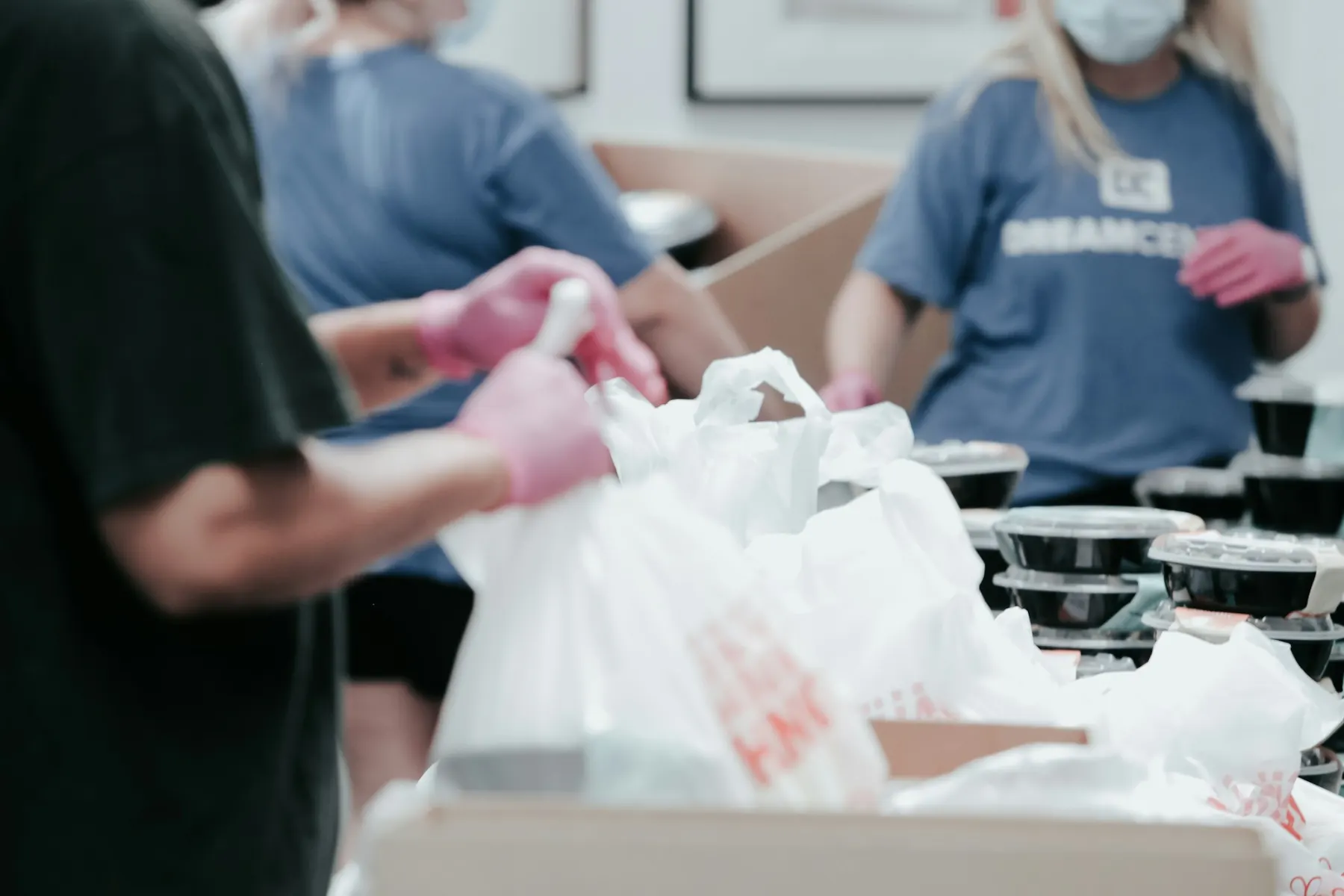 Volunteers packing food bags for community distribution